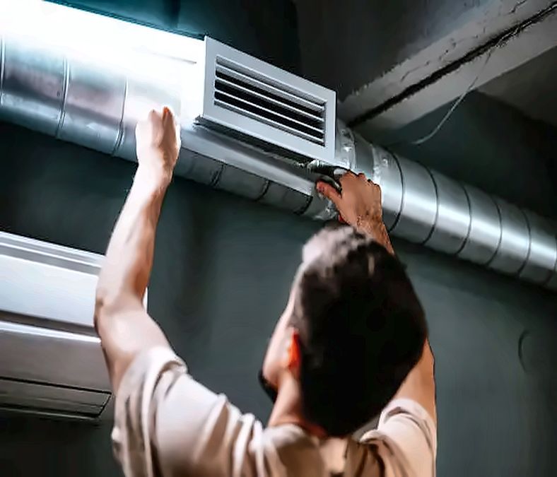 HVAC professional inspecting attic ductwork for duct cleaning in Leesburg