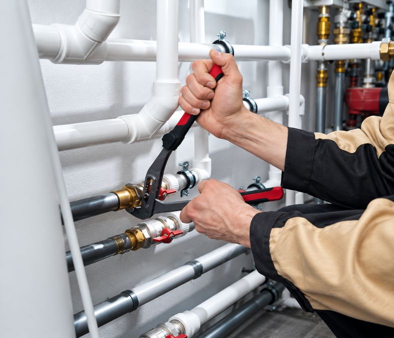 Professional plumber diagnosing a Leesburg home plumbing problem