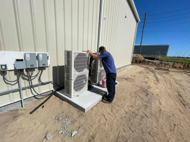 Outdoor Air Conditioner Unit Being Installed