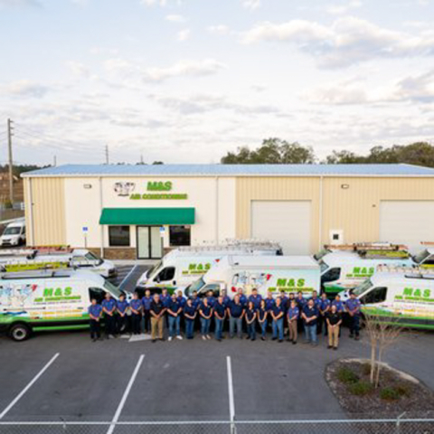 MS Team in Front of Service Vehicles