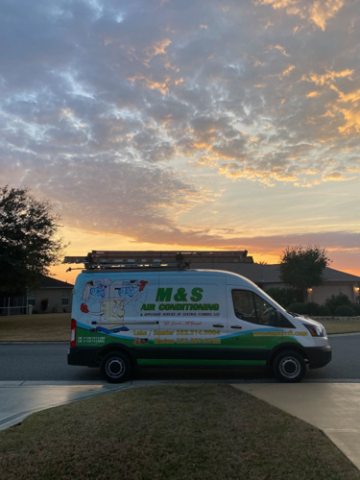 MS Van Parked in Front of Sunset